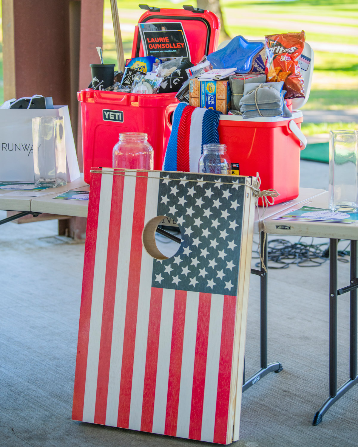 Items are displayed on tables during a charity tournament at Riverside Golf Course in Chehalis on Friday.